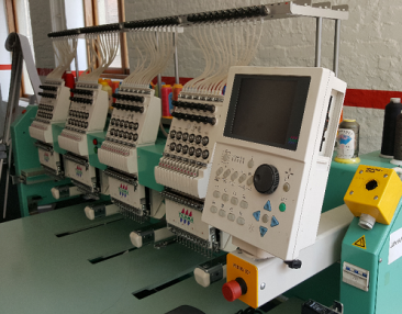 USED Tajima TFMX-C1204 - 12 Needles - 4 Head - Commercial Embroidery Machine